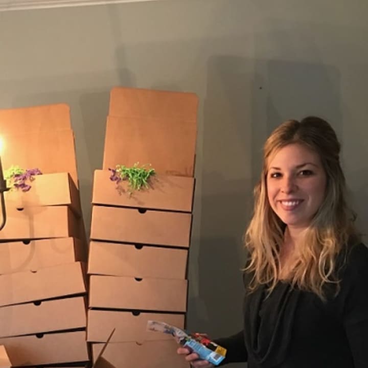 North Salem occupational therapist and mom of two Christina Kozlowski packs up subscription boxes with toys and goodies for children on the autism spectrum.