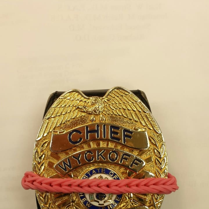 Wyckoff police officers are wearing pink bands over their badges this month in honor of those affected by breast cancer.