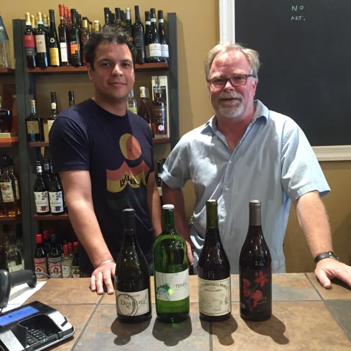 Bruno Peixoto, left, and owner Cai Palmer of Rye&#x27;s Wine at Five exhibit their favorite wines for summer.