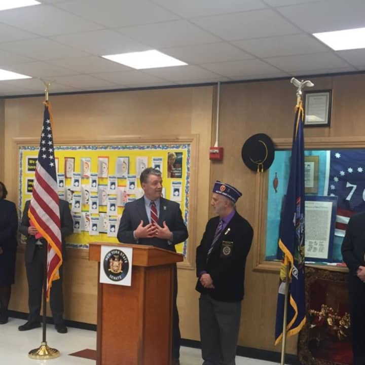 Senator Terrence Murphy honors Vietnam veteran Eugene Lang of Yorktown with a spot on the 40th State Senate District Veterans Wall of Fame during a recent ceremony at Mildred E. Strang Middle School.