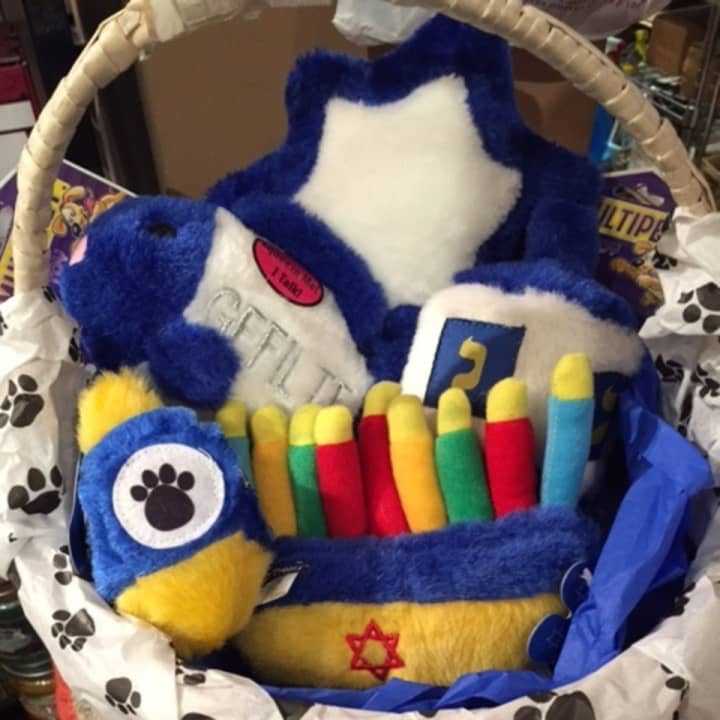 Squeaky toys with a Hannukah theme can be had for your family pet at All Paws, a Rye store.