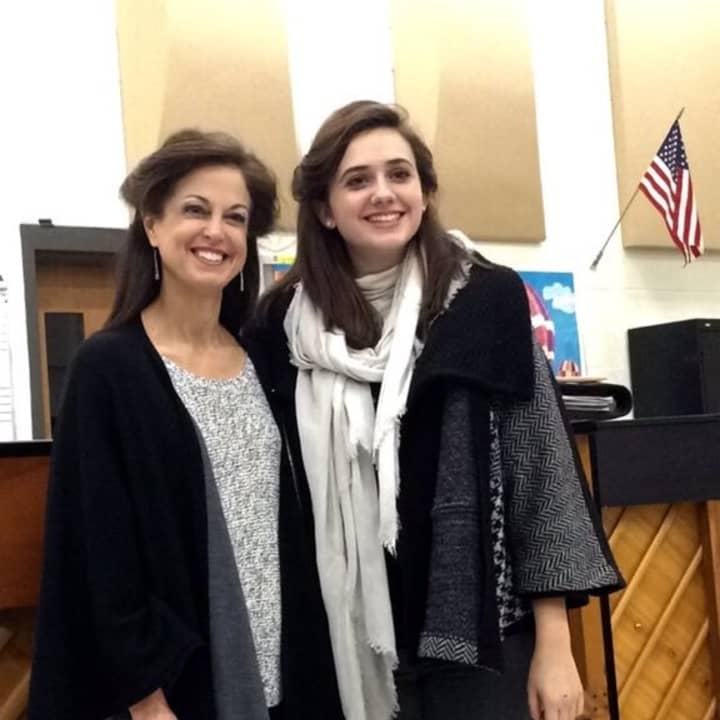 Choir director Anne Tornillo, left, is Trumbull High School&#x27;s Teacher of the Year.