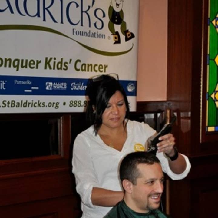 A volunteer gets his head shaved at a 2011 fundraiser sponsored by the Yonkers Police Benevolent Association. The annual event raises money for St. Baldrick&#x27;s, a foundation that funds children&#x27;s cancer research.