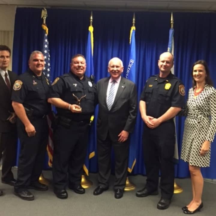 Pictured left to right are: U.S. Attorney Michael Gustafson, Chief Foti Koskinas, Officer Ned Batlin, First Selectman Jim Marpe, Lt. Ryan Paulsson and U.S. Attorney Deirdre M. Daly
