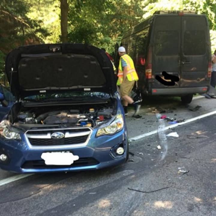 First responders examine the scene of a two-car crash on Route 129 in Cortlandt Friday.