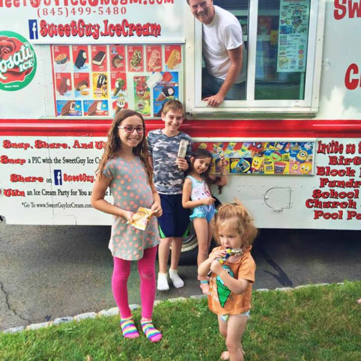 John Monahan with his SweetGuy Ice Cream Truck and some very happy patrons.