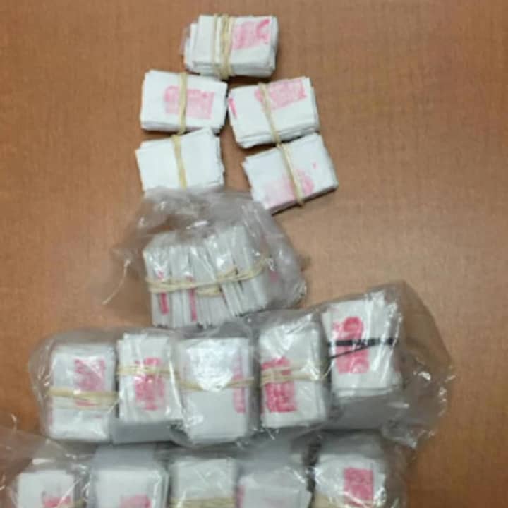 1,000 bags of heroin, 45 grams of loose heroin, 15 grams of cocaine, two handguns and and $9,000 in cash were seized in the drug trafficking bust, state police said.