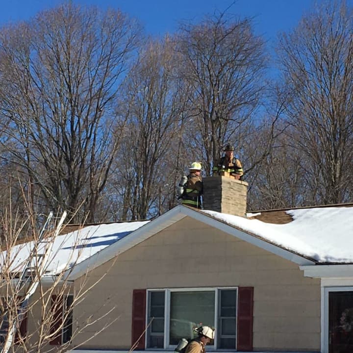 Firefighters respond to a chimney fire at a house in Shelton.