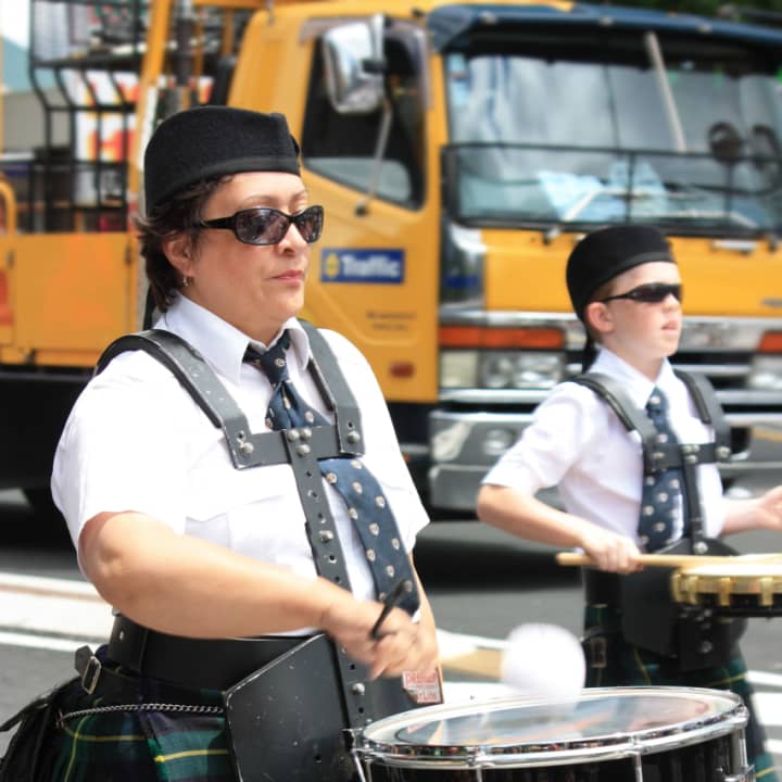 Marching band members are raising funds in a town-wide event. 