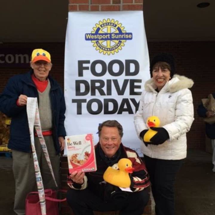 From left: Tom Lowrie, Joe Hawley and June Getrayer hold a food drive at Stop &amp; Shop with the Westport Sunrise Rotary to refill the shelves at the food pantry at the Gillespie Center in Westport.