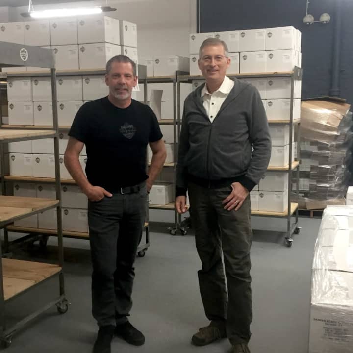 Chris Fuentes (left) and Ted Kesten (right) stand in their warehouse with boxes of Ranger Ready ready to ship.