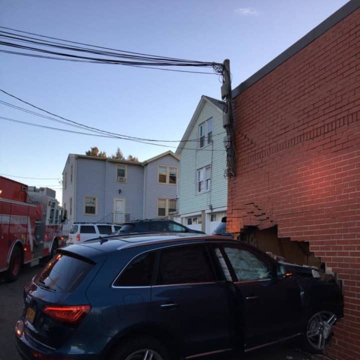 A car hit the side of a building in Greenwich Wednesday.