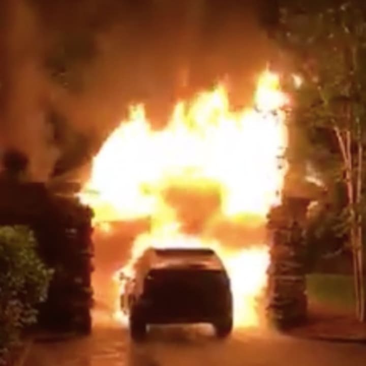 Screenshot of a video depicting a garage on Hillcrest Park Road in Greenwich going up in flames