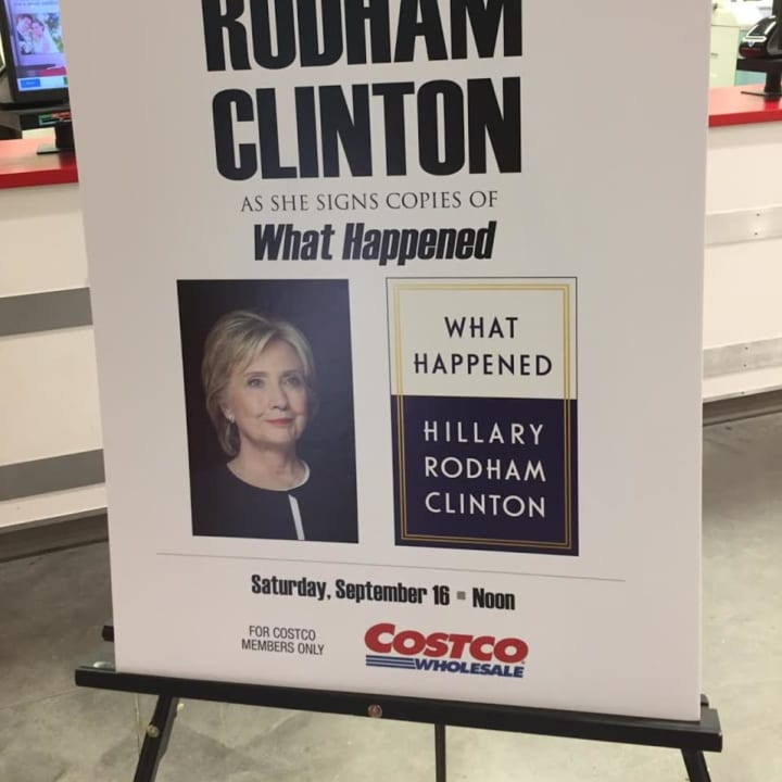 A poster at Costco promotes the Saturday book-signing by Hillary Clinton at the Brookfield store.