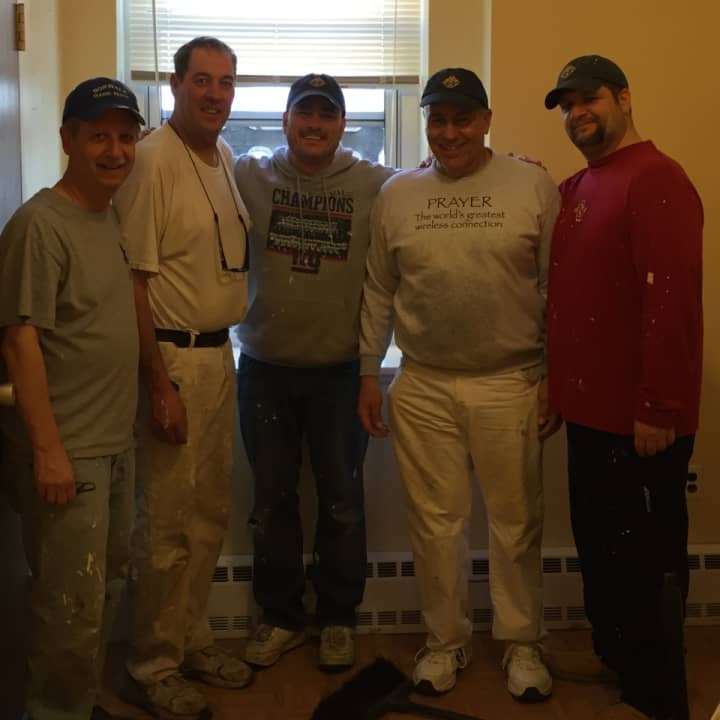 Members of the St. Matthew Norwalk Knights of Columbus pitch in at the Malta House in East Norwalk.