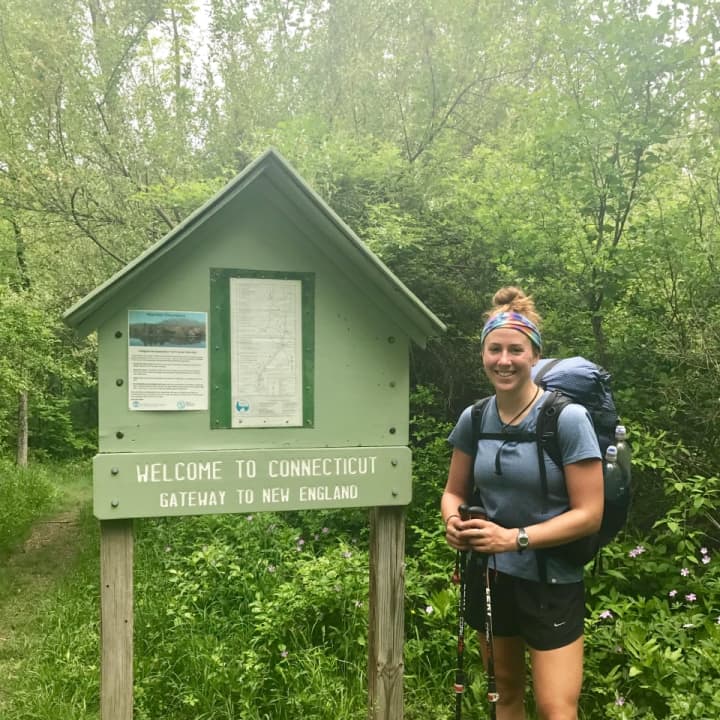 Kristen Geary, a Fairfield resident who is hiking the Appalachian Trail from Georgia to Maine this spring, arrives in Connecticut on Wednesday. The sign along the trail says &quot;Gateway to New England.&quot;