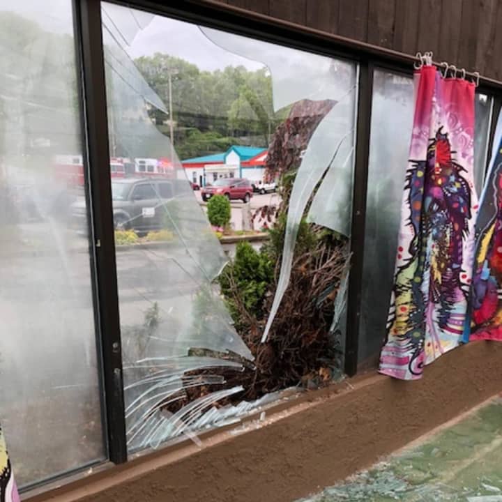 Damage to the store after a customer drove through the window.