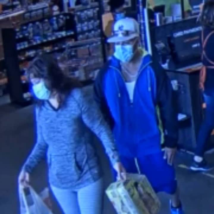 The wanted couple, who spent over $1,000 using someone else&#x27;s credit card.