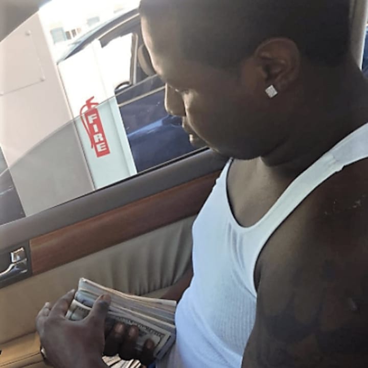 Roney flaunted his wealth on Instagram as &quot;jayshmoney,&quot; posting photos of himself holding fat stacks of cash, traveling internationally and driving luxury cars.