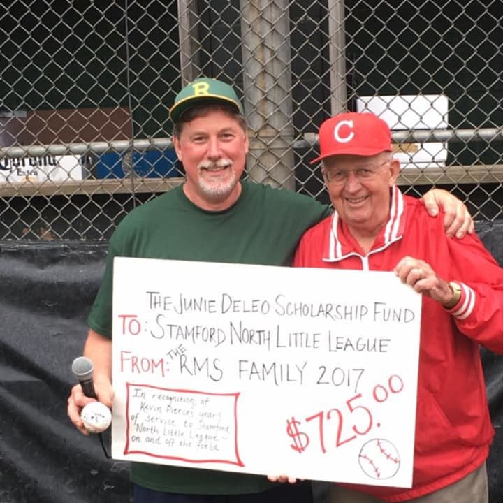Kevin Pierce, a retiring Stamford North LL manager, presents DeLeo with a &quot;check&quot; for $750 raised by his team to seed the DeLeo scholarship.