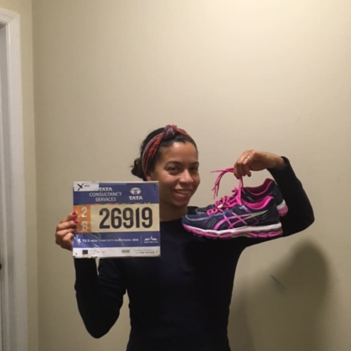 Yonkers resident Karen Rivera-Filippi shows off her number for her seventh New York City Marathon.