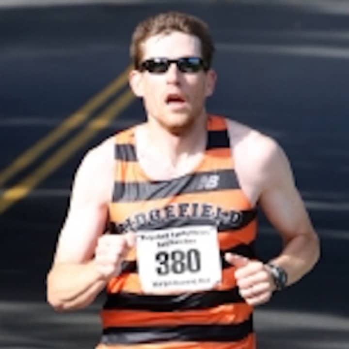 Ridgefield High School cross country coach Bryan Kovalsky won the Ridgefield Half Marathon on Sunday. 