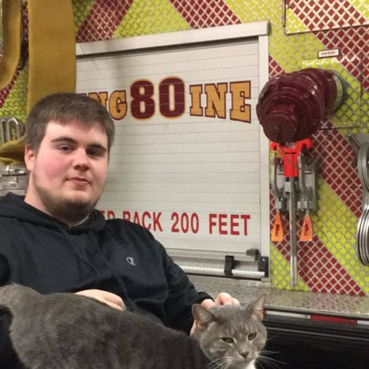 A volunteer at Riverside Engine Co. No. 4 in Tarrytown holds a cat that wandered in one day and now doesn&#x27;t seem to want to leave.