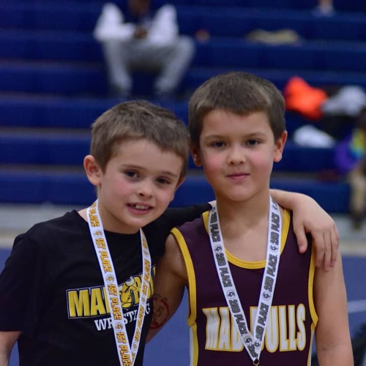 Second grade Mad Bull Grapplers Will Motley and Colin Falla both medaling in the Wilton tournament after meeting each other in the finals.