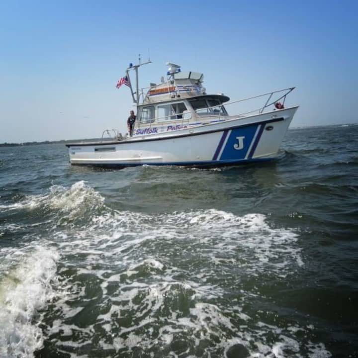 Suffolk County Police Marine Unit officers rescued a family of four from Long Island Sound after their boat began taking on water.