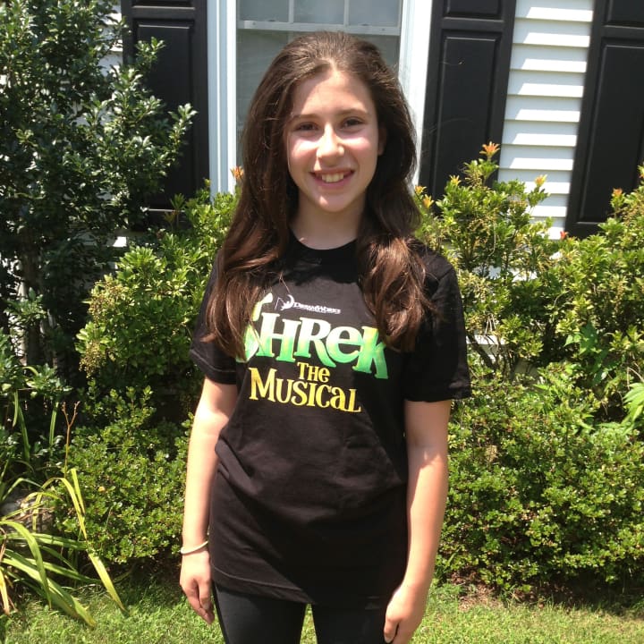 Isabella Salant of New Canaan wears her &quot;Shrek The Musical&quot; t-shirt, a production she will be acting in along with two others from town. 