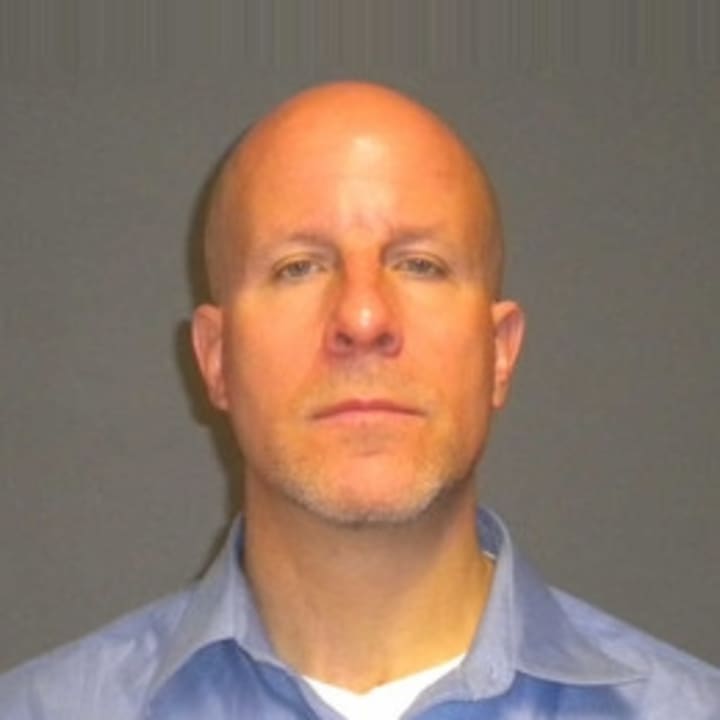 Glenn Mishuck was arrested Thursday on charges of having a sexual relationship with a student. 