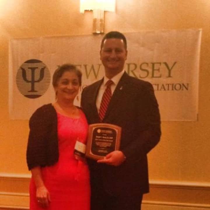 Elmsford School Superintendent Dr. Joseph Ricca receives his &quot;Citizen of the Year&quot; award from the New Jersey Psychological Association.
in New Jersey last week.