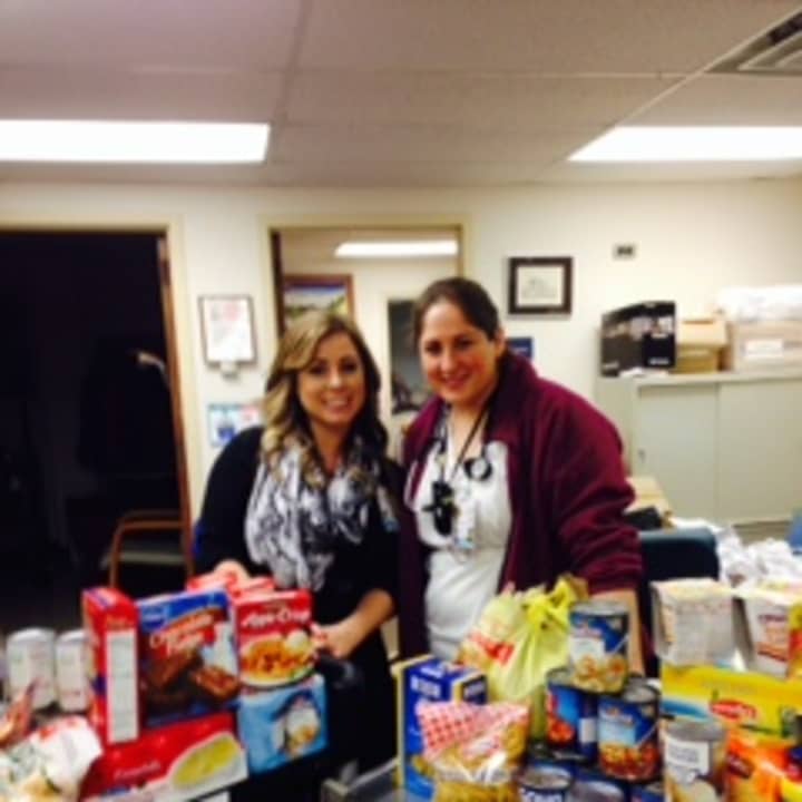NWH Employee Congress Co-Chairs Lauren DeSha, Medical Records and Kim Mulroy, RN with just SOME of the food collected from staff and visitors for the Mount Kisco Food Pantry Thanksgiving Food Drive.