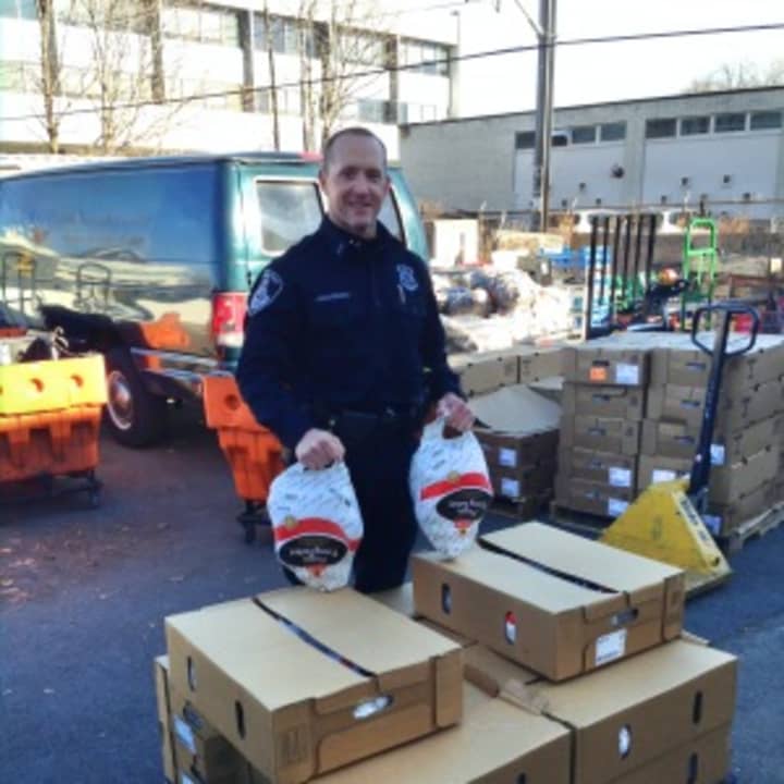 Stamford police officers from all over the city worked together to bring dozens of frozen turkeys to the Food Pantry of Lower Fairfield County prior to one of the biggest holiday meals in the American calendar. 