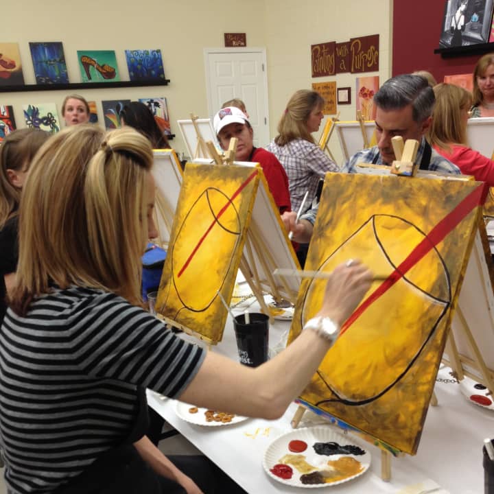 Painting With A Twist brings painting and wine together.