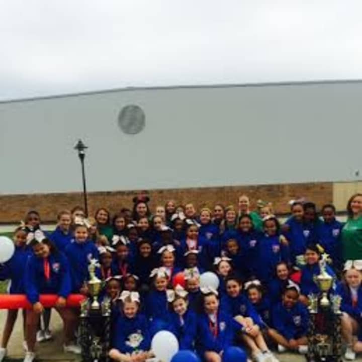 Two Norwalk cheerleading teams celebrate after winning championships last weekend in Orlando, Fla.