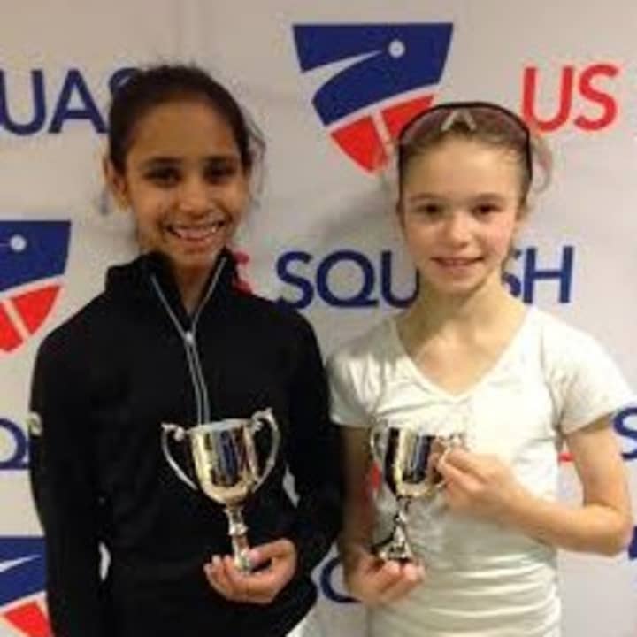 Nina Mital of West Harrison and Marina Stefanoni of Darien show trophies they won at the U.S. Junior Championships in New Haven. They play squash out of Chelsea Piers Connecticut in Stamford.