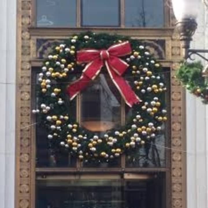 A giant Christmas wreath hangs over the door at the Bank of America in downtown Stamford. 