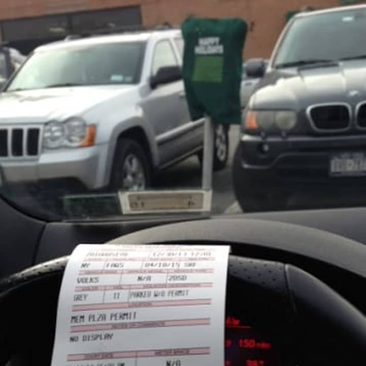 A ticket for a car in Pleasantville.