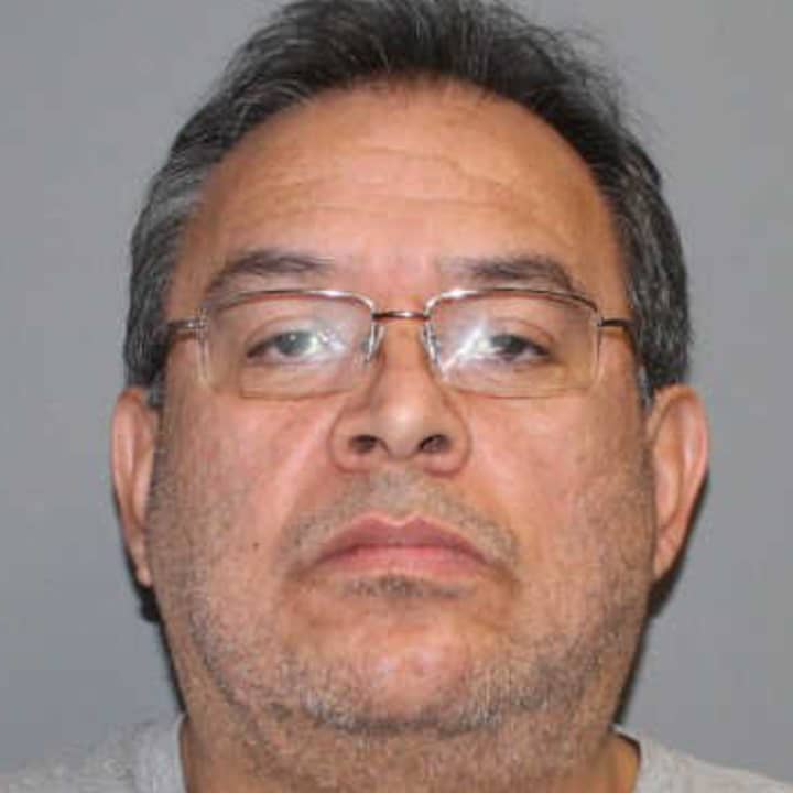 Carlos Perez, 54, of Norwalk was charged with reckless endangerment, risk of injury to a minor and unlawful discharge of a firearm Monday.