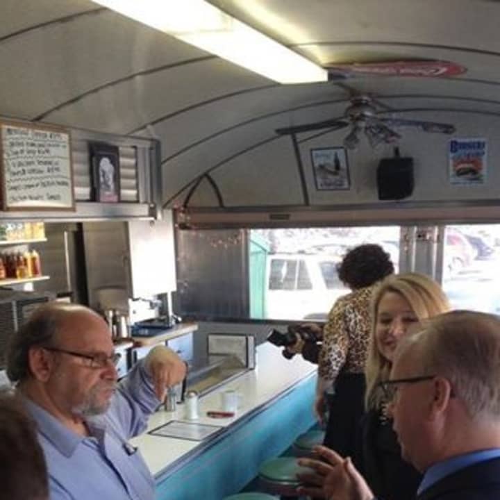 Mark Boughton, right, and Heather Somers greet customers at Norm&#x27;s Diner in Groton.