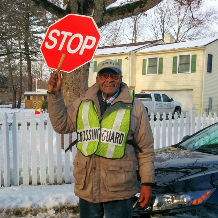 Stamford&#x27;s Roosevelt Mitchell puts a smile on kids&#x27; faces in his job as a crossing guard at Pepperidge and Harvest Hill Roads.
