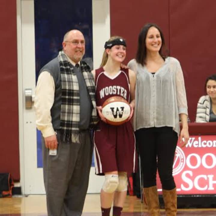 Wooster School senior Kate MacNutt was honored for scoring her 1,000 career point recently. 