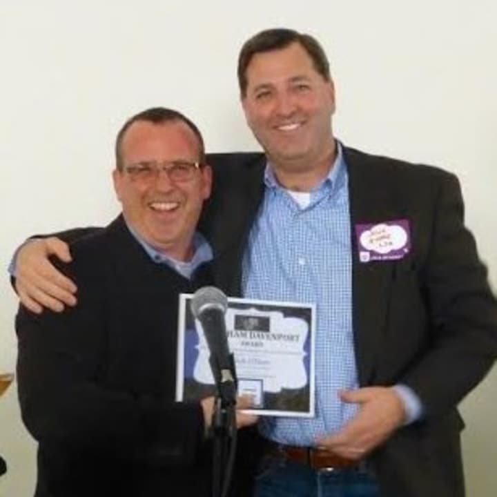 Peter Propp, left, chief Marketing Officer of Stamford Innovation Center presents an award to Dick O&#x27;Hare of New Canaan.
