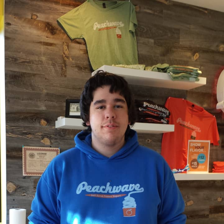 Eamon Flaherty, an senior at Wilton High School working at Peachwave, is in favor of raising the federal minimum wage, but thinks $10.10 would be too high.
