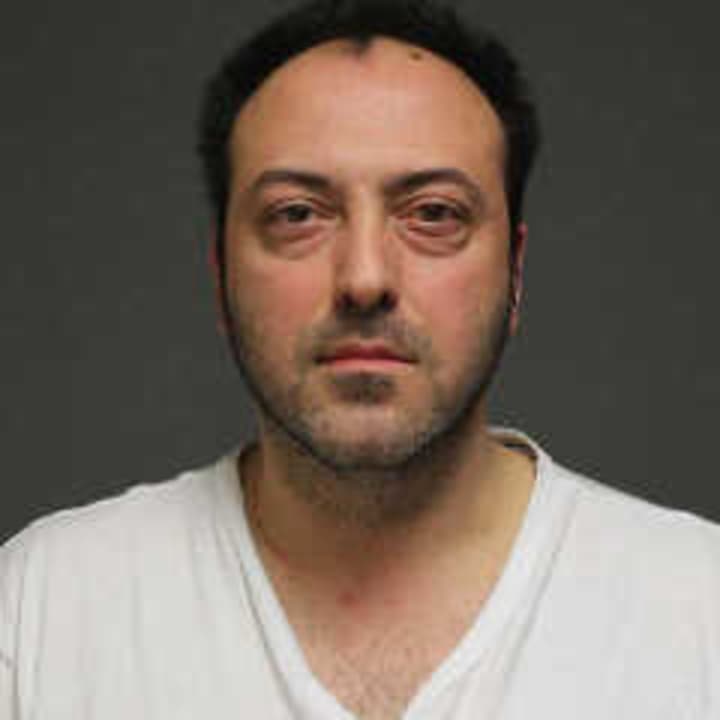 Nikolaos Simoulidis, 39, of Norwalk was charged by Fairfield police with breach of peace after a fight in a parking lot Friday, March 28.
