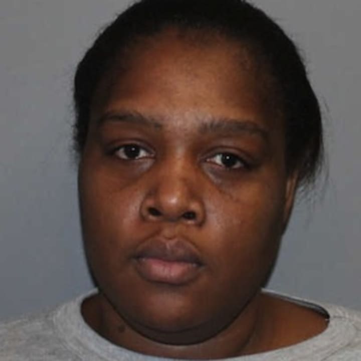 Maria Dorissaint of Stamford was charged in Norwalk with stealing the identities of her sister and an elderly man she worked for as a health care aide.