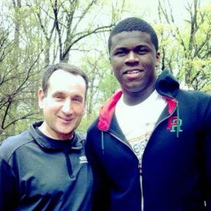 Former Greens Farms Academy basketball star Sean Obi, right, met Duke basketball coach Mike Krzyzewski this week. Obi will transfer to Duke from Rice.