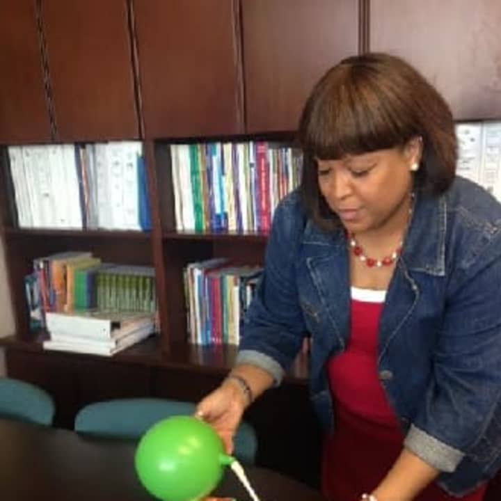 Natalie Elder, Stamford Public Schools director for school improvement and professional development for elementary schools, is running the balloon-powered race car activity at STEMfest on Saturday, April 26, at Mill River Park.