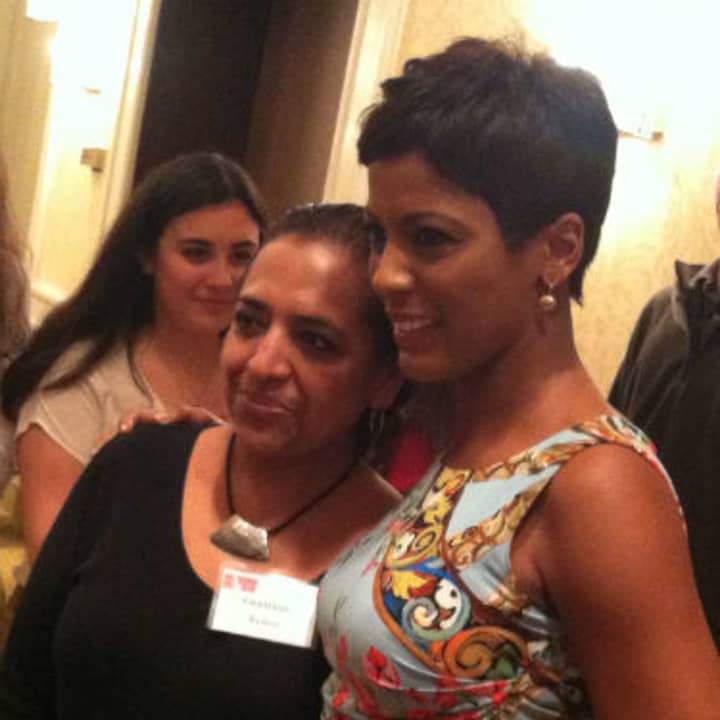 NBC&#x27;s Tamron Hall poses with Stamford&#x27;s Guadalupe Ramos, at left, for a photograph after Hall&#x27;s speech at the annual spring luncheon of the Domestic Violence Crisis Center. It was held Thursday in Stamford. 